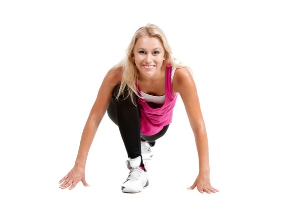 Blond meisje in sportieve kleding rekken — Stockfoto