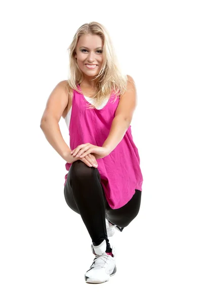 Blond tjej i sportiga kläder stretching — Stockfoto