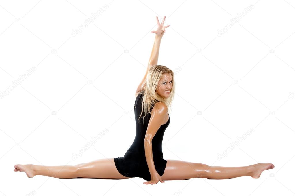 blonde girl in sporty clothes stretching