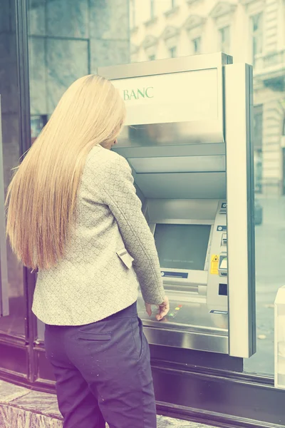 Woman using Bank ATM machine — Stock Photo, Image