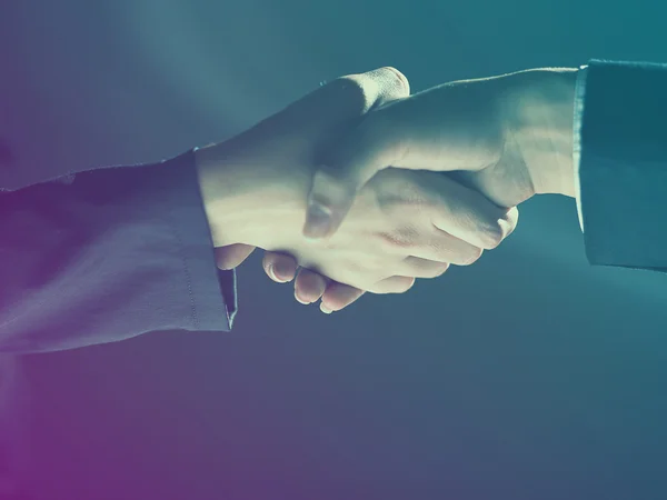 Handshake Handshaking on light and dark — Stock Photo, Image