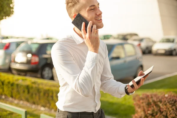 Businessman with mobile phone tablet in hands — Stock Photo, Image