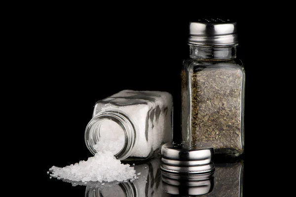 Salt and oregano shakers — Stock Photo, Image