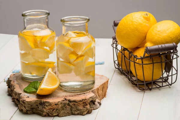 Lemon and lime slices in jars — Stock Photo, Image