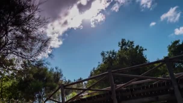 Timelapse of clouds over a wooden bridge — Stock Video