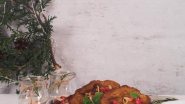 Traditional Christmas Rabanadas with pommegranate seeds, pine nuts and cinnamon. Spanish Torrijas or french toasts close up on the countertop.