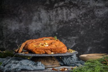 Traditional Christmas Rabanadas with lemon zest, raisins, pine nuts and cinnamon. Spanish Torrijas or french toasts close up on the countertop