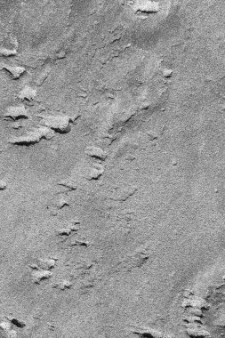 Kumda karmaşık desenler oluşmuş, gri manzara fotoğrafı..