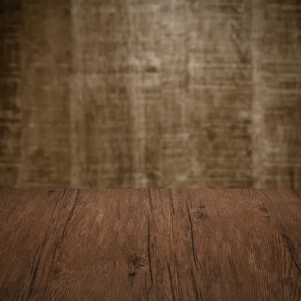 Table with wooden wall — Stock Photo, Image