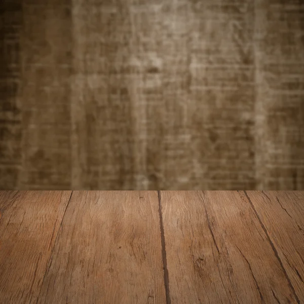 Table with wooden wall — Stock Photo, Image