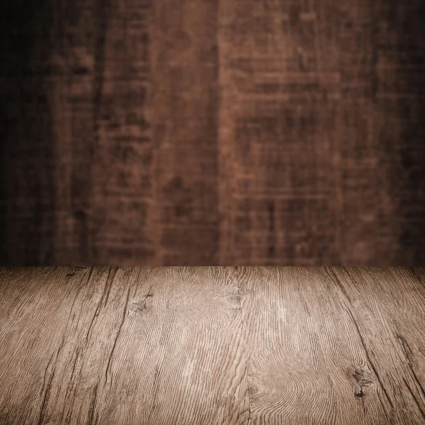 Table with wooden wall — Stock Photo, Image