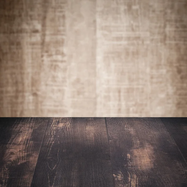 Table with wooden wall — Stock Photo, Image