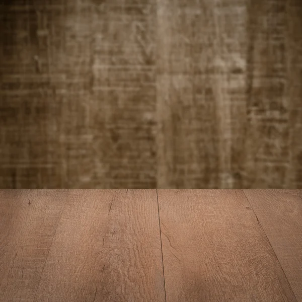 Table with wooden wall — Stock Photo, Image