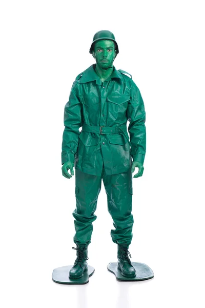 Homem em um traje de soldado de brinquedo verde — Fotografia de Stock