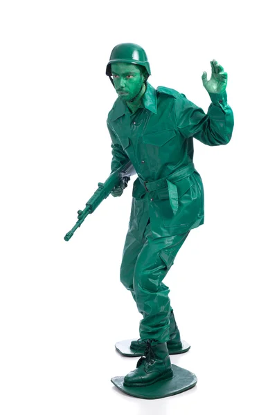 Homem em um traje de soldado de brinquedo verde — Fotografia de Stock