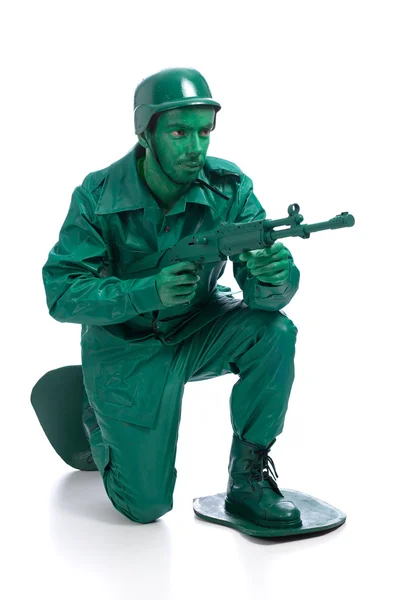 Muž na zelené hračka voják kostým — Stock fotografie