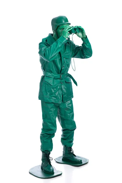 Homem em um traje de soldado de brinquedo verde — Fotografia de Stock
