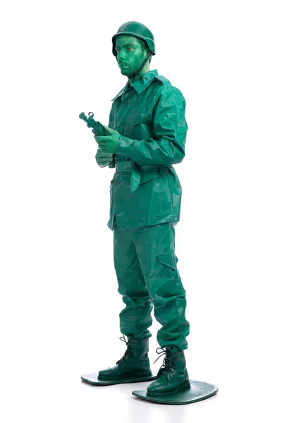 Adam bir yeşil oyuncak asker kostümü — Stok fotoğraf