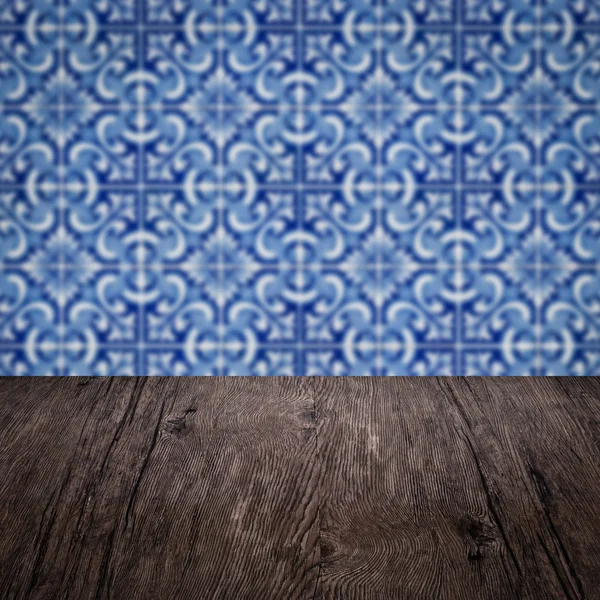 Wood table top and blur ceramic tile wall — Stock Photo, Image