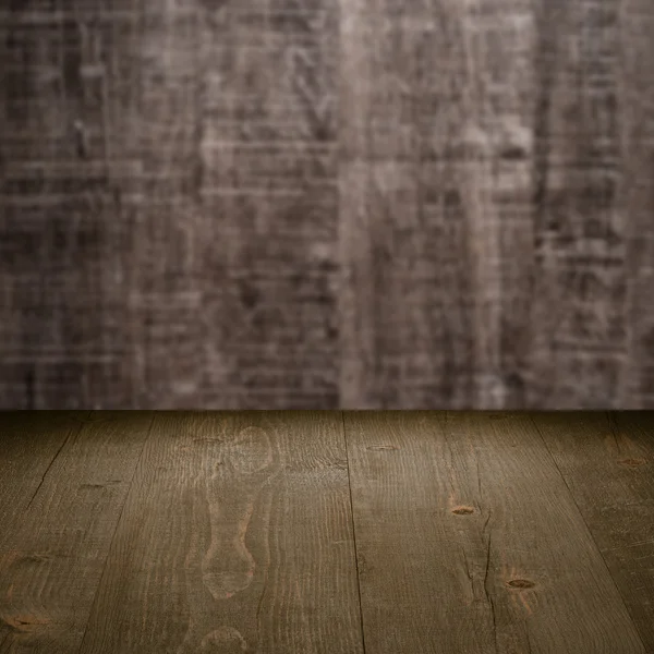 Mesa com parede de madeira — Fotografia de Stock