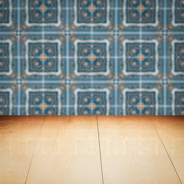 Wood table top and blur ceramic tile pattern wall — Stock Photo, Image