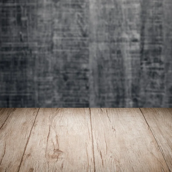 Table with wooden wall — Stock Photo, Image