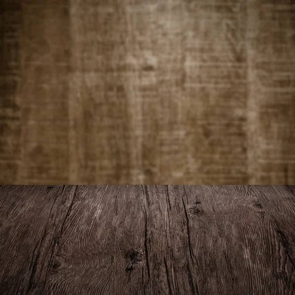 Table with wooden wall — Stock Photo, Image