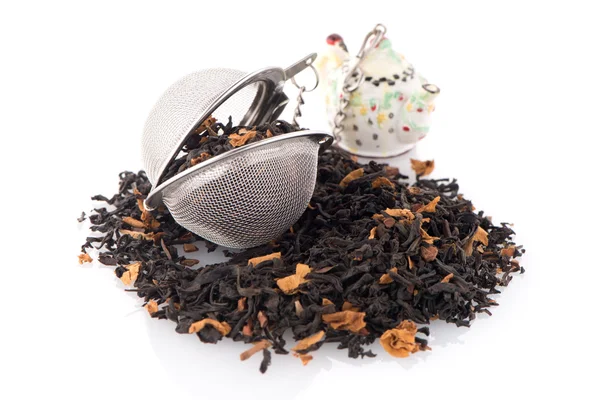 Black dry tea with petals — Stock Photo, Image
