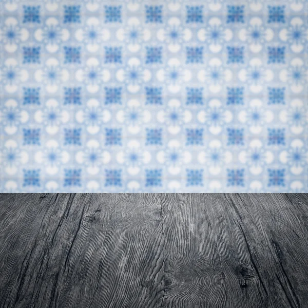 Wood table top and blur   ceramic tile  wall in background — Stock Photo, Image