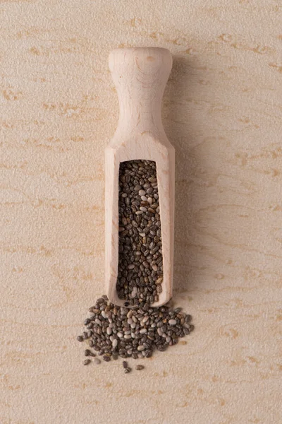 Wooden scoop with chia seeds — Stock Photo, Image