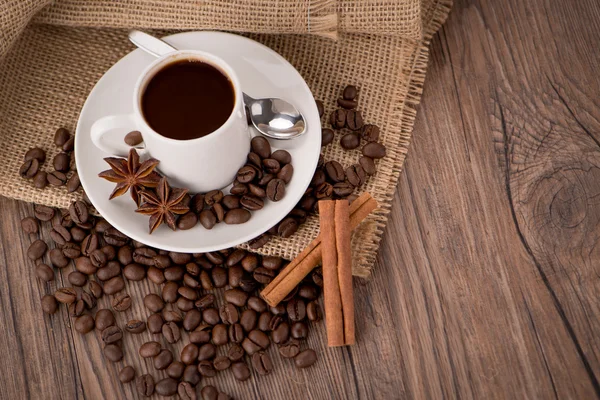 Coffee cup with burlap sack — Stock Photo, Image