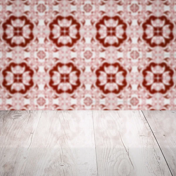 Wood table top and blur  ceramic tile pattern — Stock Photo, Image