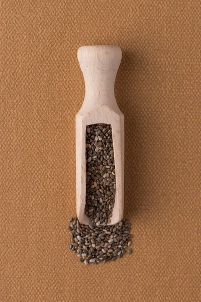 Wooden scoop with chia seeds — Stock Photo, Image