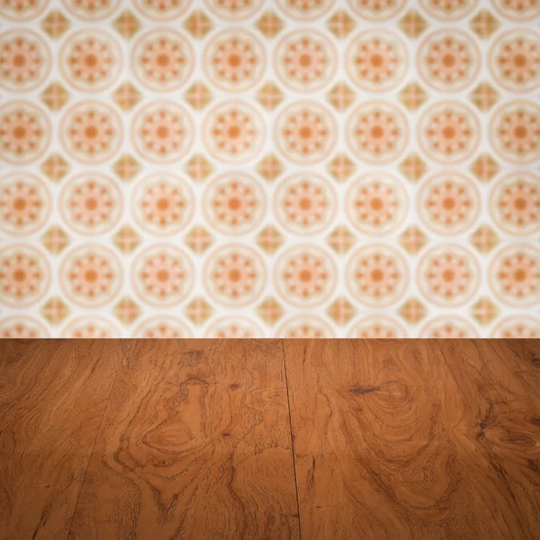 Wood table top and blur vintage ceramic tile pattern wall — Stock Photo, Image