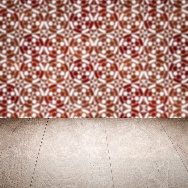 Wood table top and blur vintage ceramic tile pattern wall — Stock Photo, Image