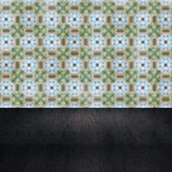 Wood table top and blur vintage ceramic tile pattern wall — Stock Photo, Image