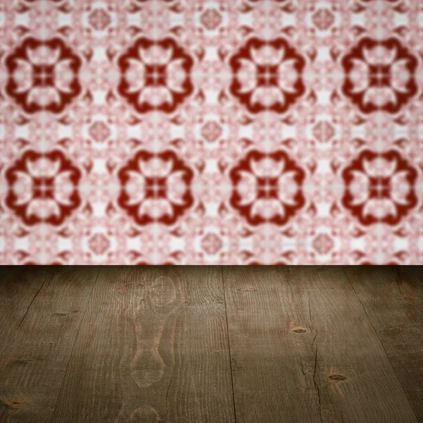 Wood table top and blur vintage ceramic tile pattern wall — Stock Photo, Image