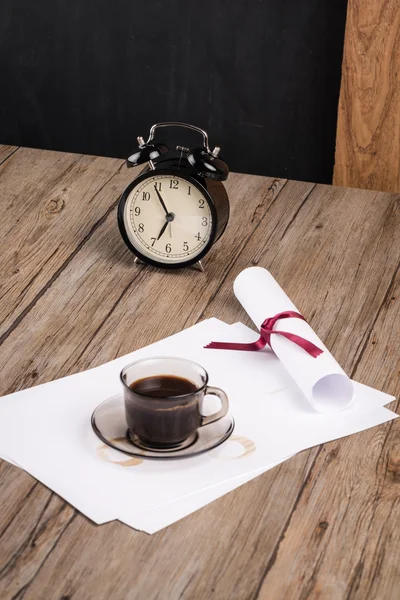 Old clock, hat, coffee and paper sheets — Stock Photo, Image