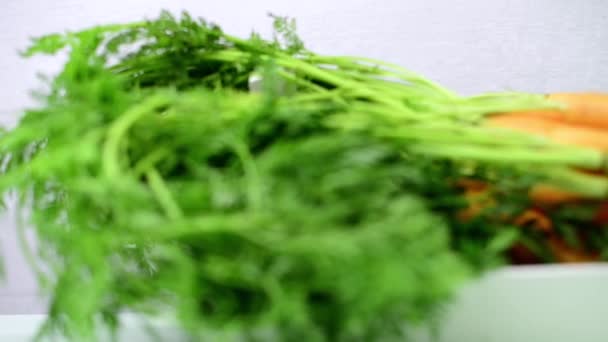 Carrots on wooden table — Stock Video