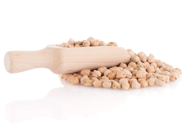 Uncooked chickpeas and wooden scoop — Stock Photo, Image