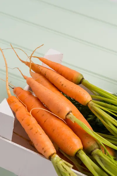 Carrots on wooden table — Stock Photo, Image