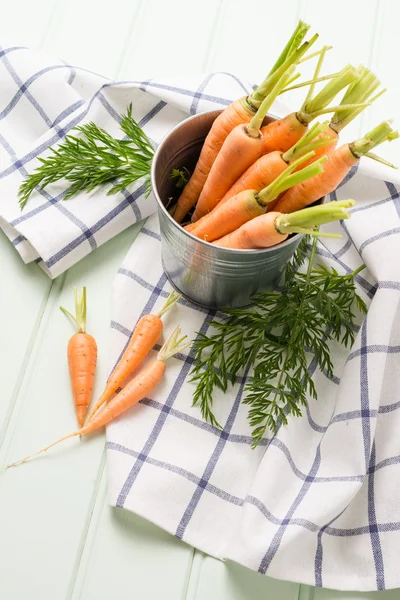 Carrots on wooden table — Stock Photo, Image