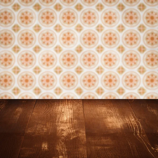 Wood table top and blur vintage ceramic tile pattern wall — Stock Photo, Image