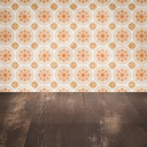 Wood table top and blur vintage ceramic tile pattern wall — Stock Photo, Image