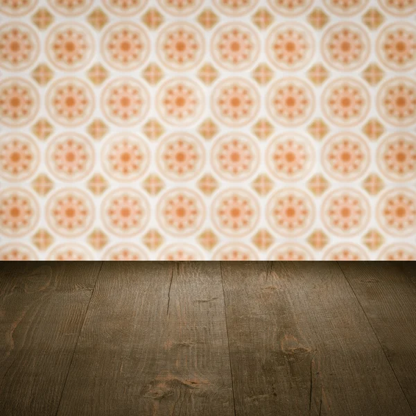 Wood table top and blur vintage ceramic tile pattern wall — Stock Photo, Image