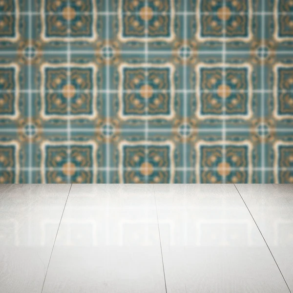 Wood table top and blur vintage ceramic tile pattern wall — Stock Photo, Image