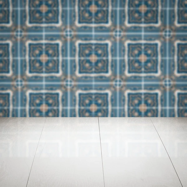 Wood table top and blur vintage ceramic tile pattern wall — Stock Photo, Image