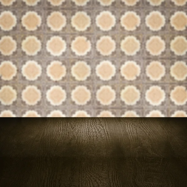 Wood table top and blur vintage ceramic tile pattern wall — Stock Photo, Image