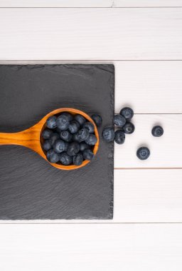 Blueberries on a wooden spoon
