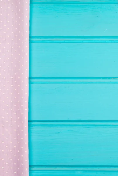 Pink towel over wooden table — Stock Photo, Image